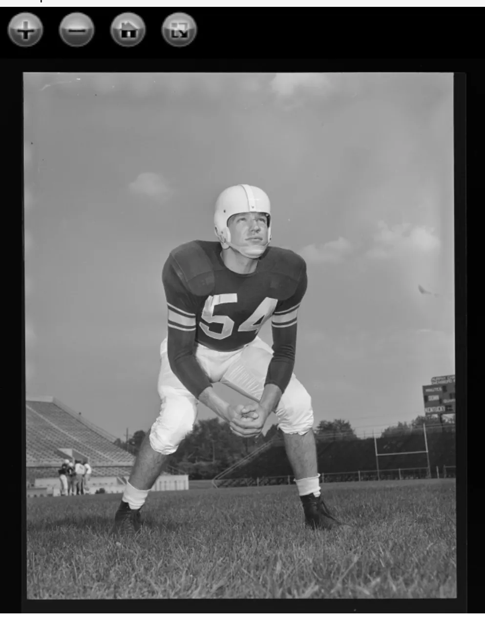 Mack Hughes negative showing Frank Fuller in number 54 in a stance portrait.