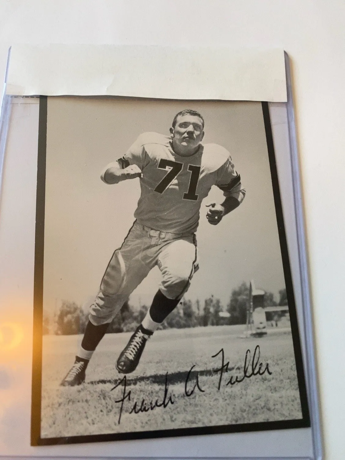 Owned Rams running pose item of Frank Fuller.